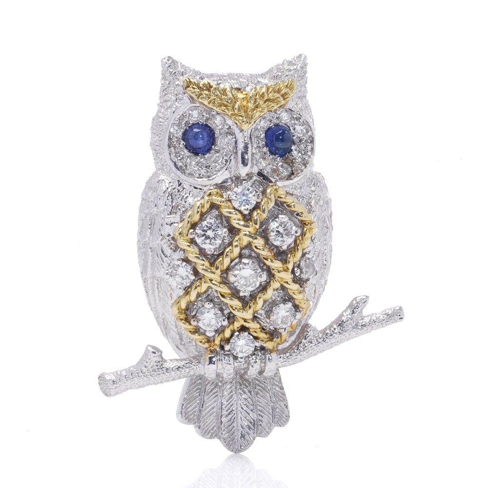 Sapphire and Diamond owl brooch with sapphire eyes in white and yellow gold. on branch