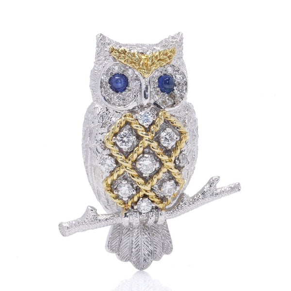 Sapphire and Diamond owl brooch with sapphire eyes in white and yellow gold. on branch