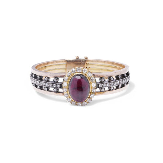 Antique garnet and diamond bangle in yellow gold and silver.