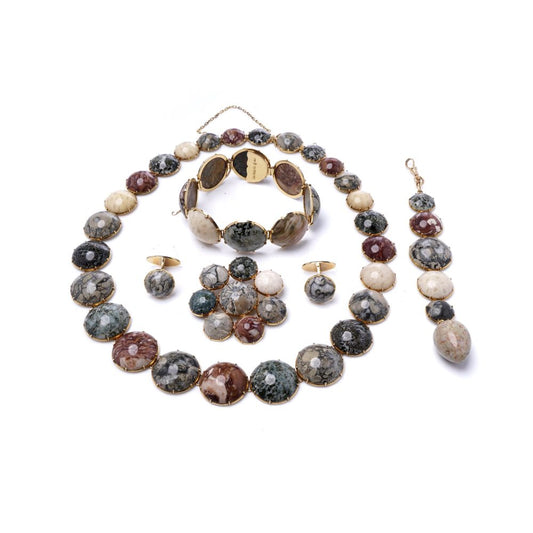 Swedish jewellery set with gemstones in gold.