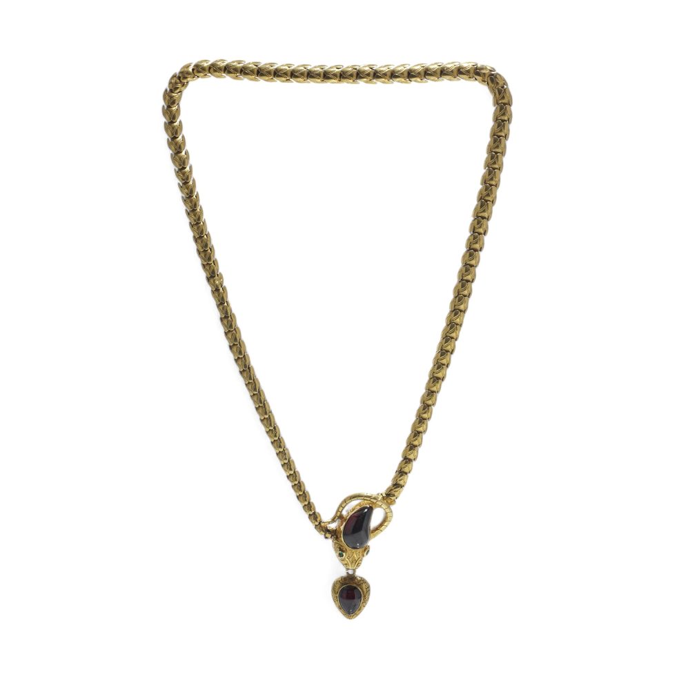 Victorian snake necklace with garnets and emeralds in gold.