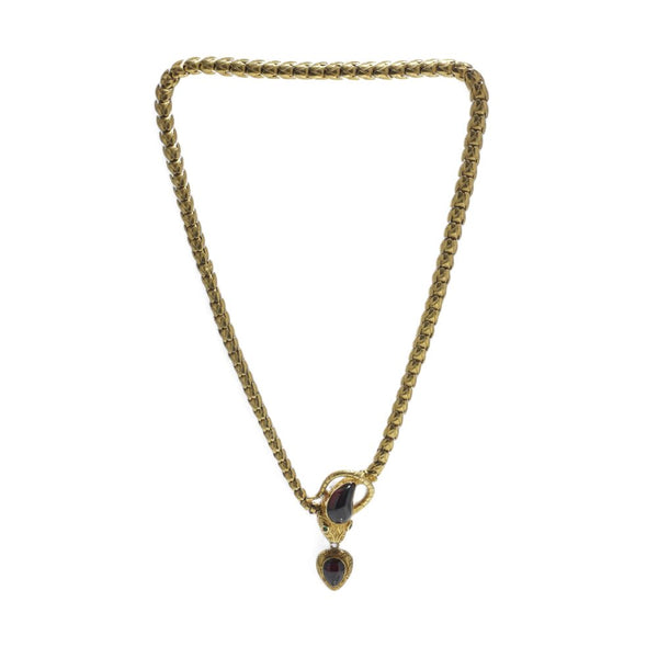 Victorian snake necklace with garnets and emeralds in gold.