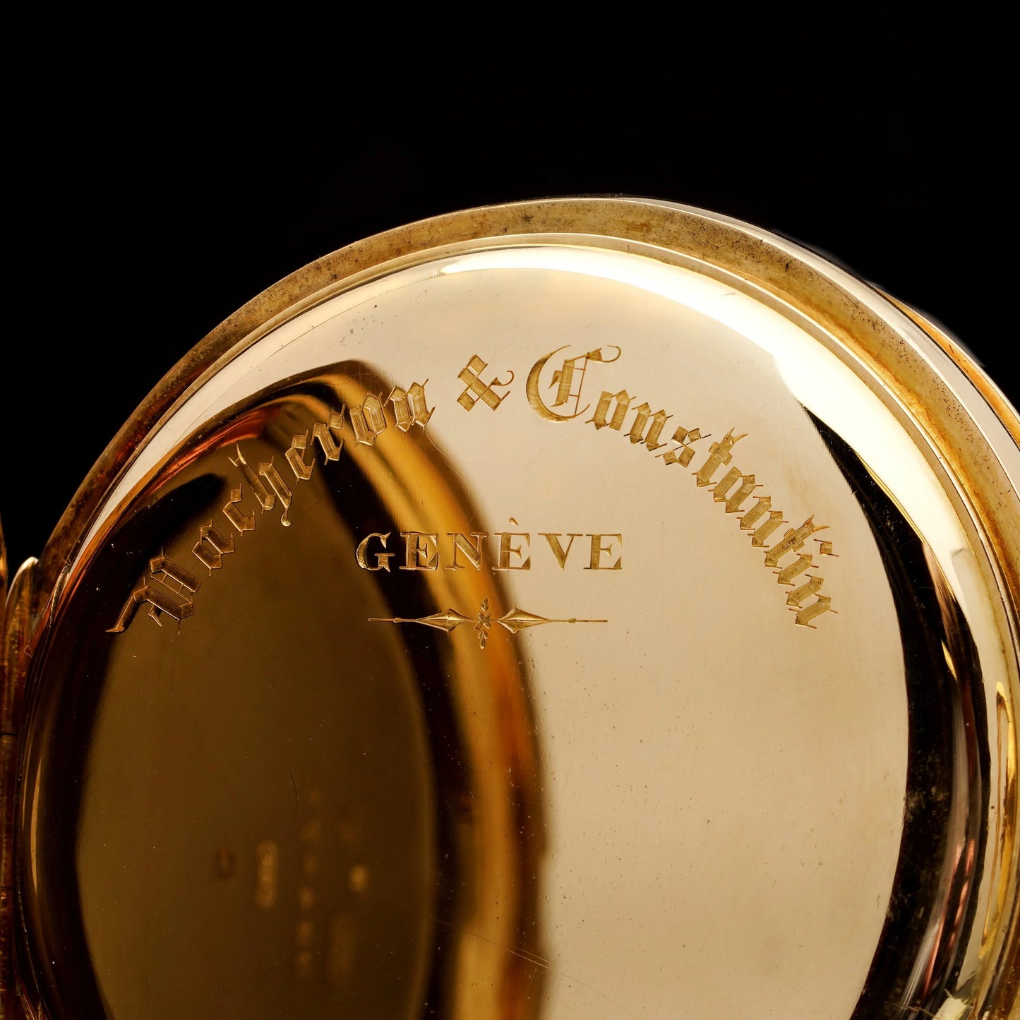 Close-up of Vacheron & Constantin Geneve engraving inside a yellow gold case