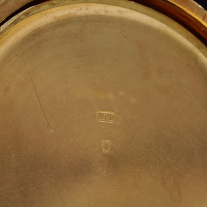 An 18C stamp inside a yellow gold case