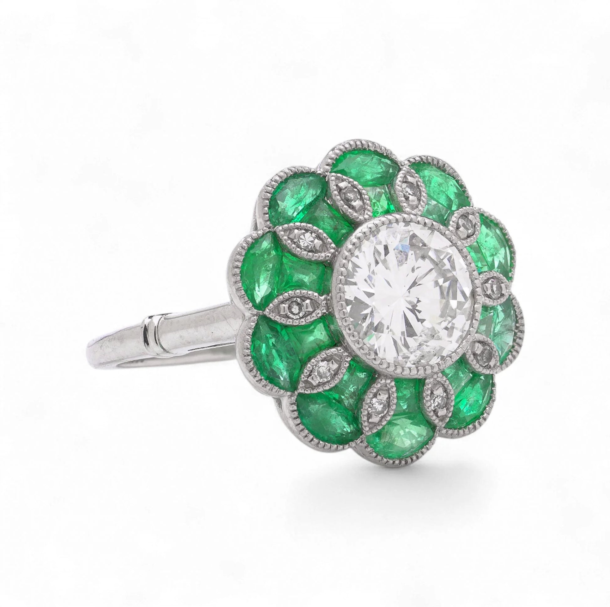 Contemporary Diamond and Emerald Flower Cluster Engagement Ring in Platinum