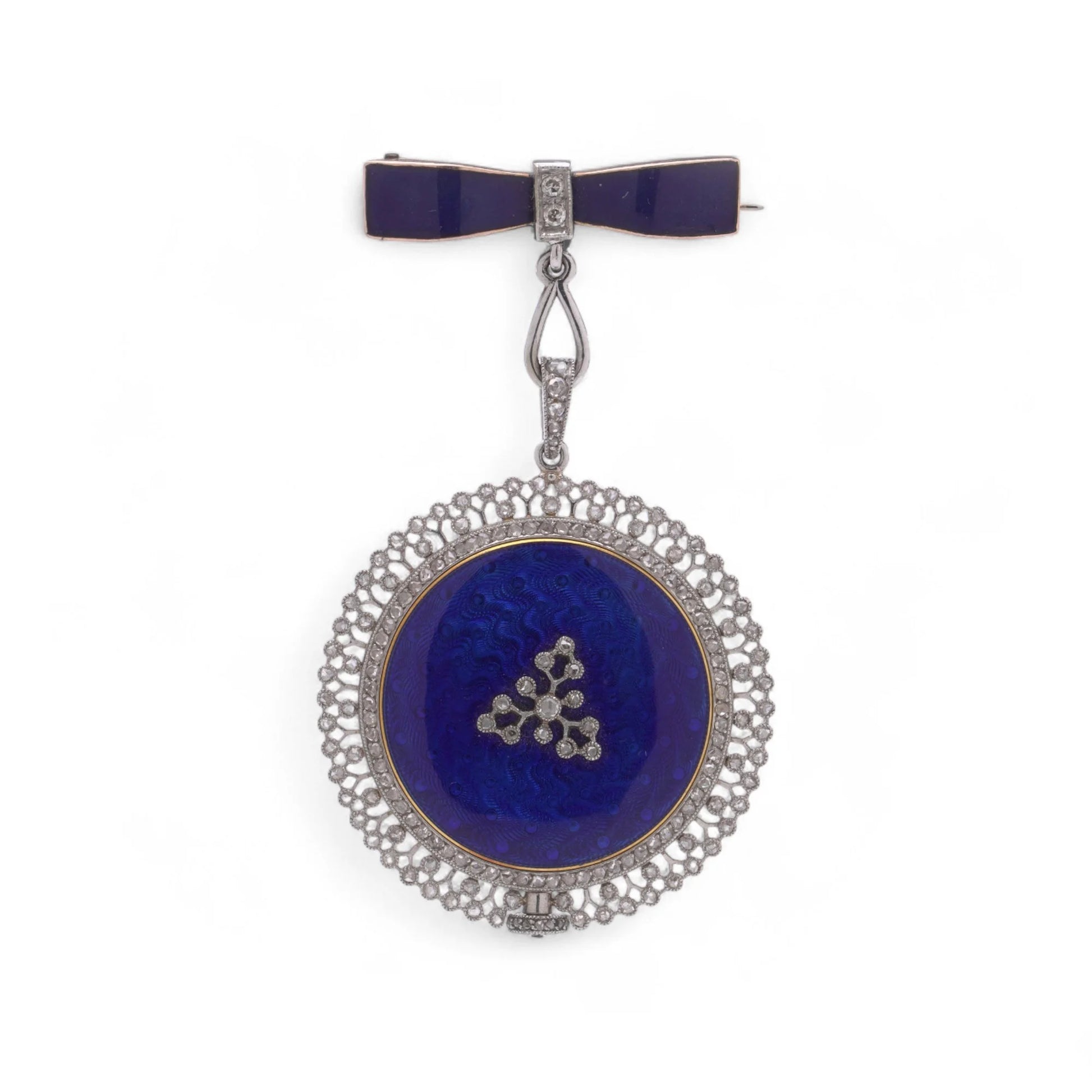 A blue enamel pendant pocket watch in silver with diamonds, suspended by a bow brooch fitting, on a white background
