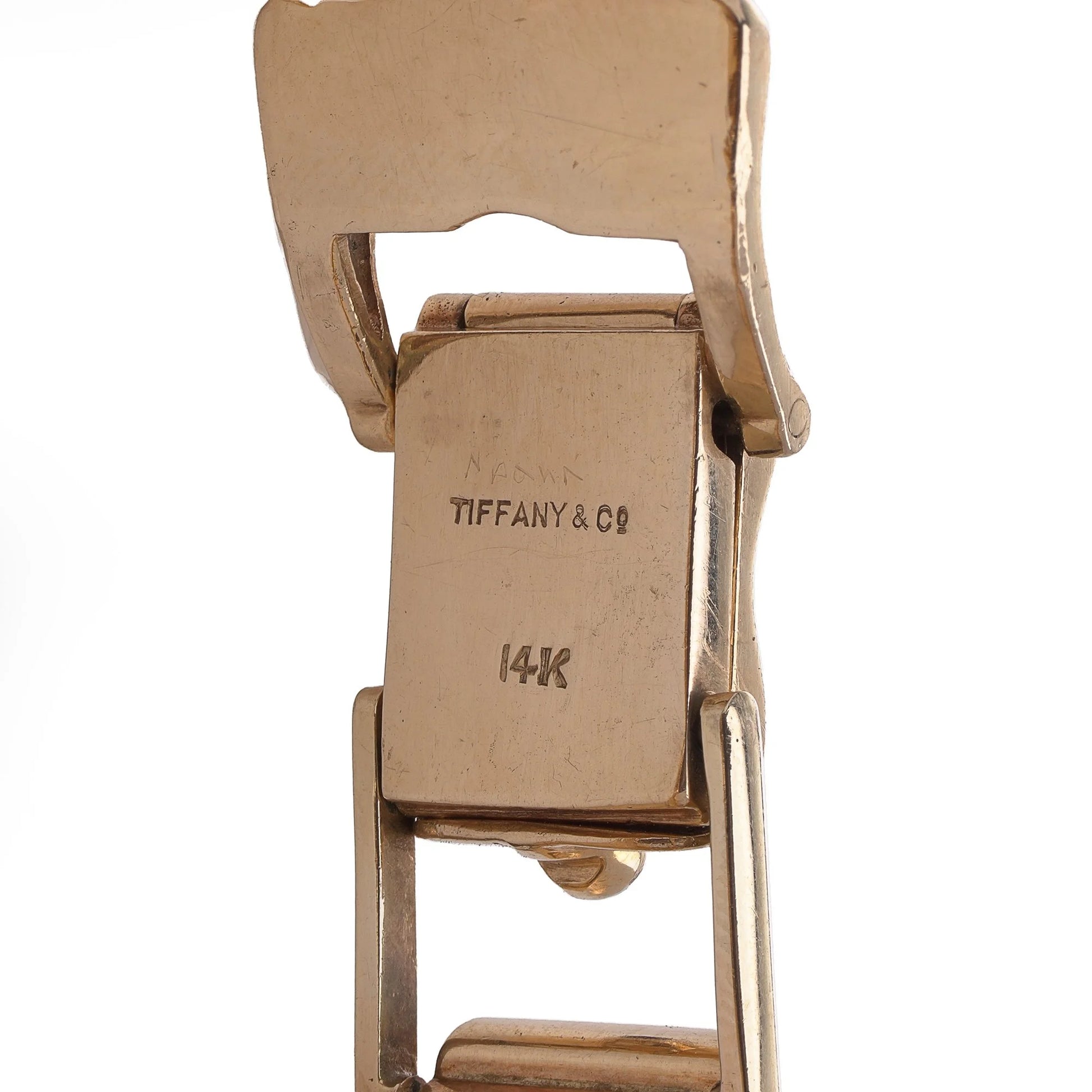 Close-up of a yellow gold bracelet clasp stamped Tiffany & Co 14K