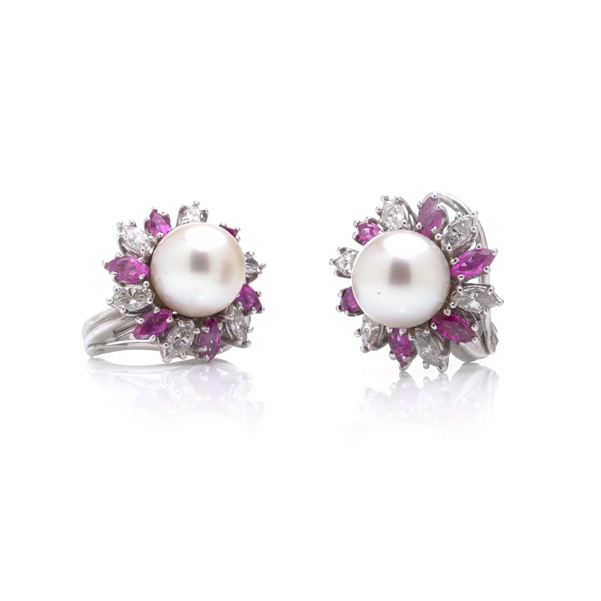 A pair of pearl, pink sapphire and diamond cluster earrings, on a white background