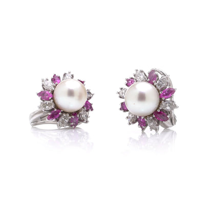 A pair of pearl, pink sapphire and diamond cluster earrings, on a white background