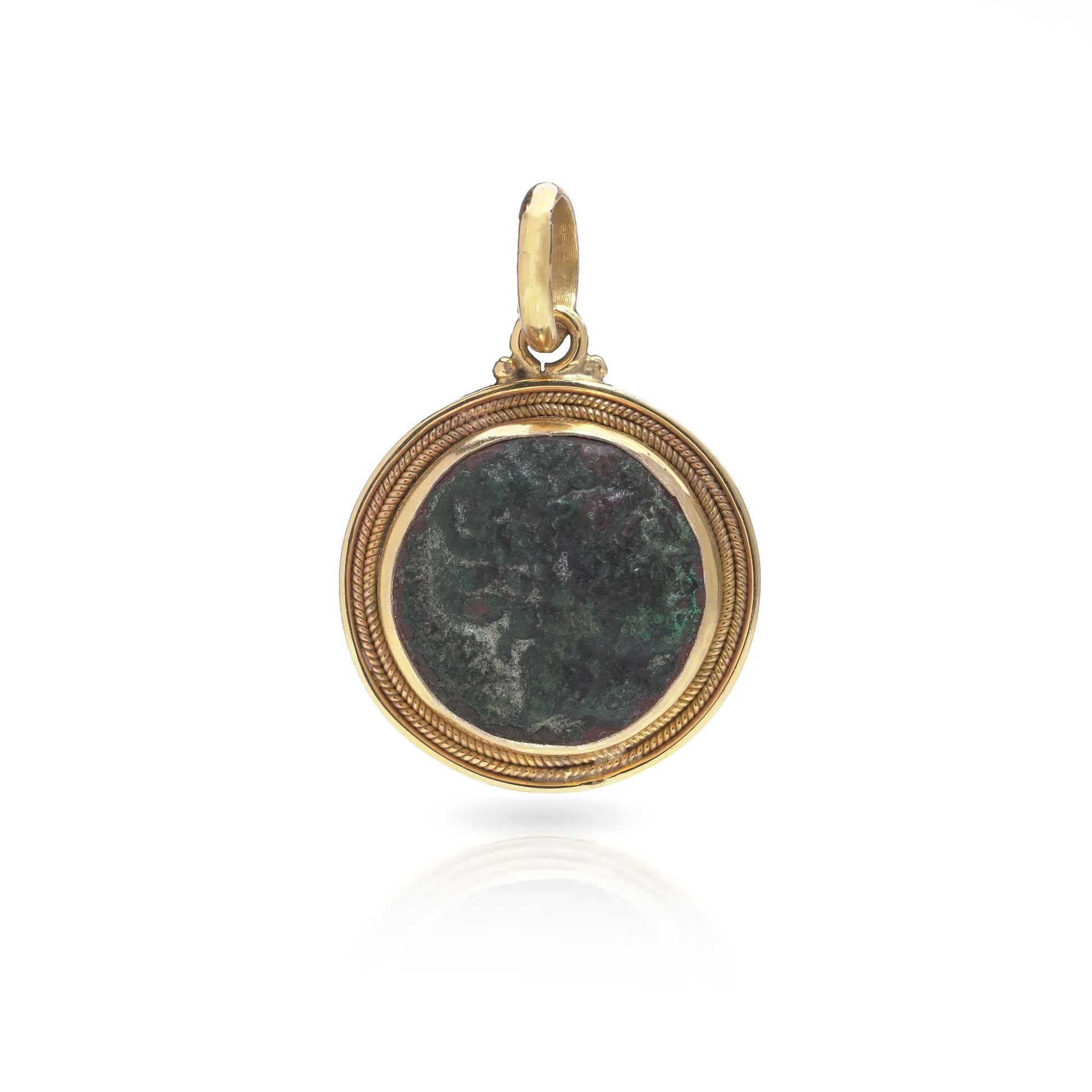 A yellow gold pendant featuring an oxidised ancient Roman coin, on a white background