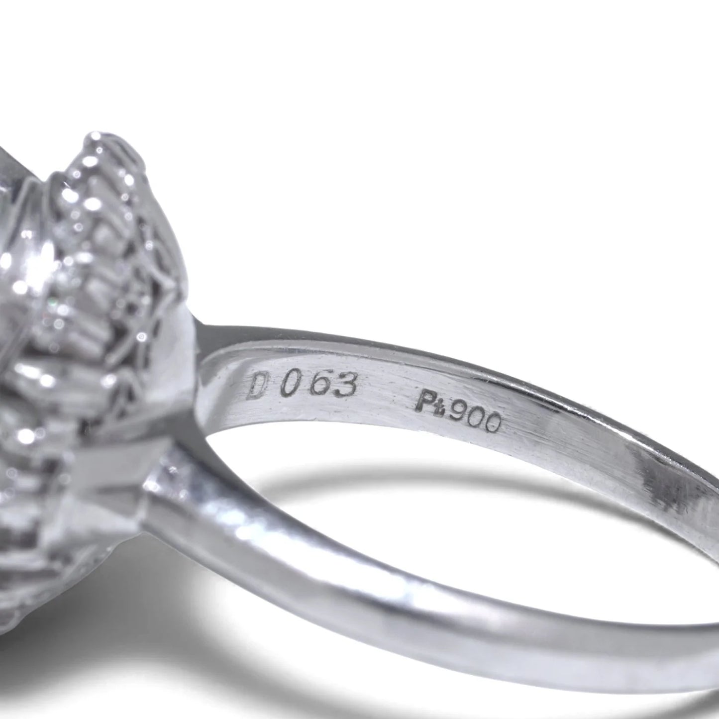 Pt900 and D063 stamps inside a platinum ring shank