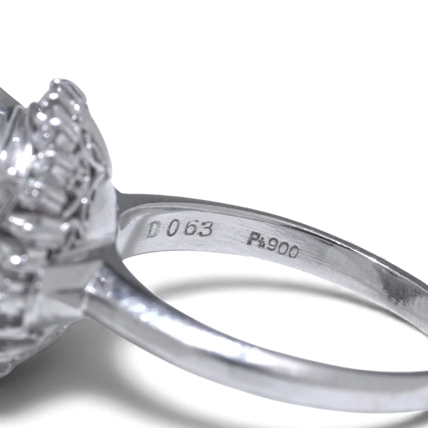 Pt900 and D063 stamps inside a platinum ring shank
