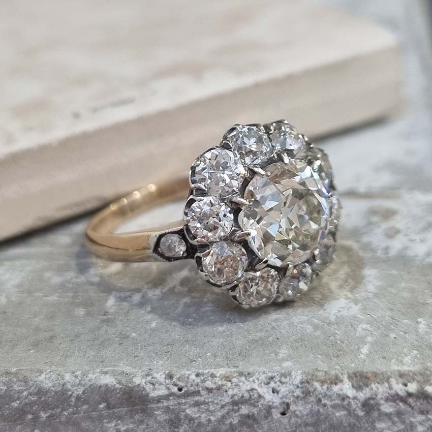 Antique Old Mine Cut Diamond Cluster Engagement Ring, over 4cts, 2.33ct old mine-cut diamond surrounded by 2cts of old-cut diamonds in platinum and 18ct yellow gold