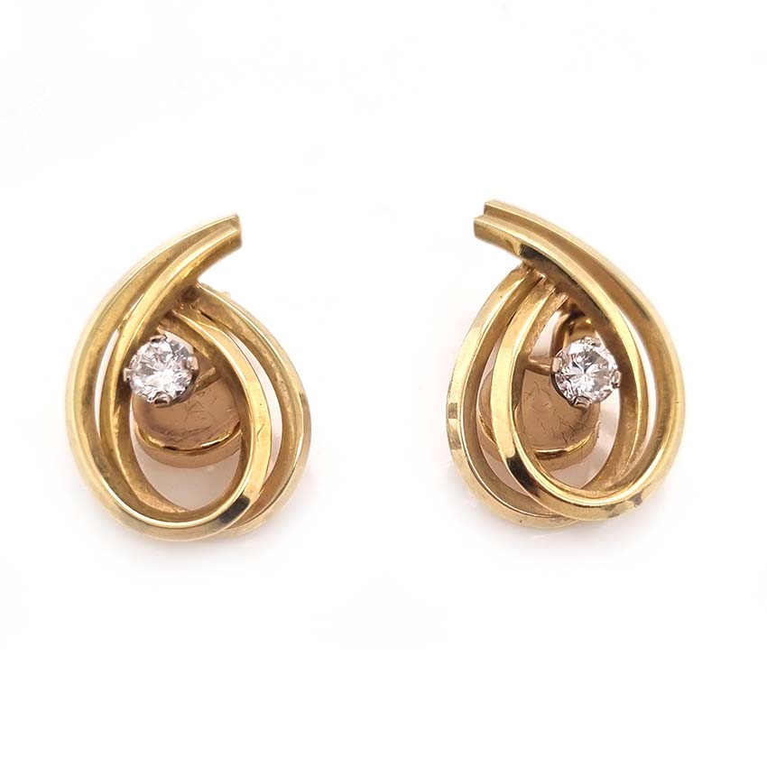 Vintage Diamond and Gold Clip Earrings by Garrards,f 14ct yellow gold swirl design clip-on earrings each with central brilliant-cut diamond. Circa 1970. Hallmarked Garrards and Co. Ltd London, date 1970