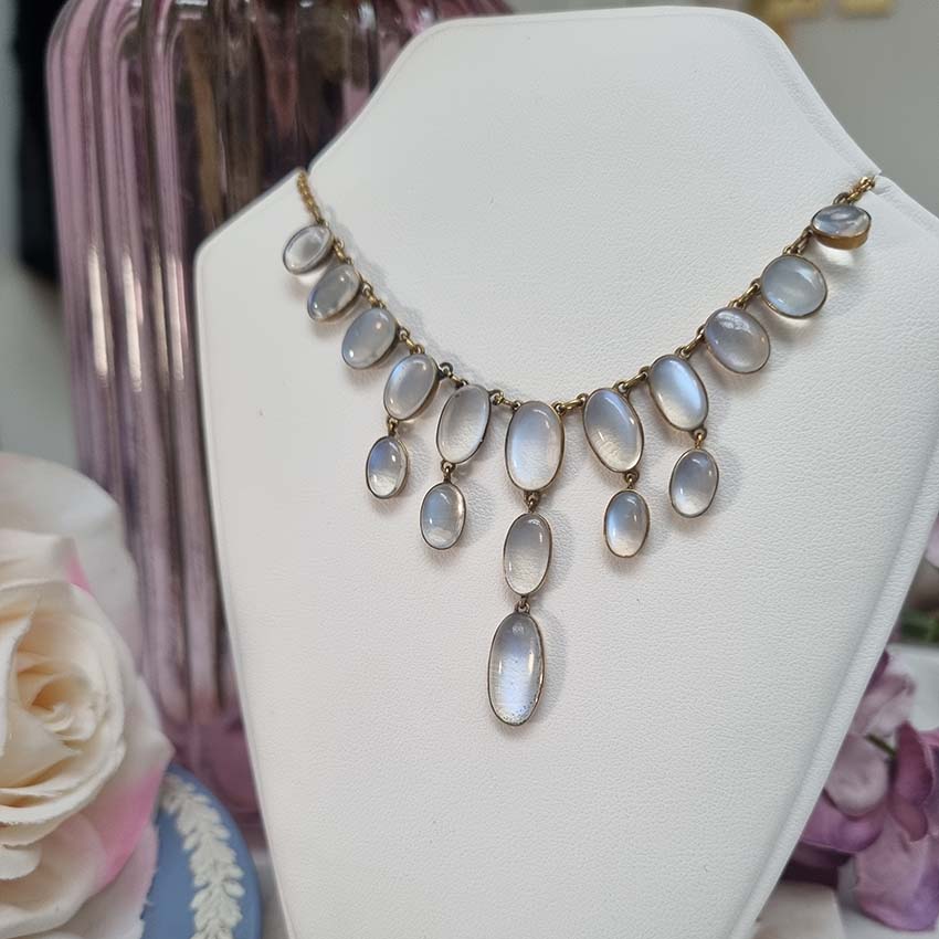 Antique Arts and Crafts Moonstone Fringe Necklace, set with graduating drops of spectacle set oval cabochon moonstone. Circa 1890