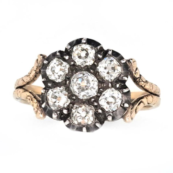 Antique Old Cut Diamond Flower Cluster Engagement Ring, 0.80 carat total, old mine-cut diamond surrounded by six diamonds in timeless floral design in yellow gold with decorative split shoulders
