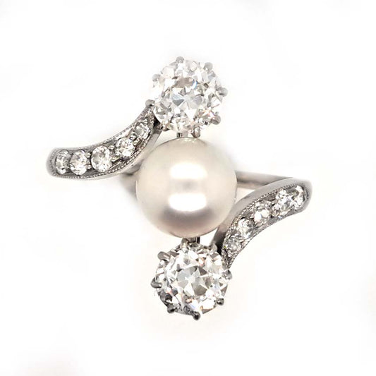 Antique Natural Pearl and Old Cut Diamond Three Stone Ring, natural pearl and 1.44cts old mine cut diamonds with diamond crossover shoulders in 18ct white gold