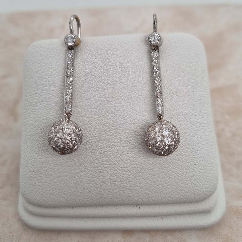 Vintage 1ct Diamond Ball Sphere Cluster Drop Earrings, diamond encrusted spheres suspended from diamond drops in platinum with shepherd hook fittings. Circa 1930