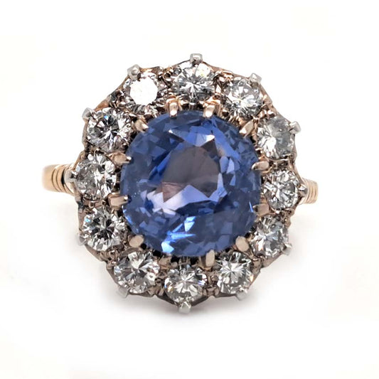 Antique Art Deco 4.50ct Cornflower Blue Ceylon Sapphire and 1.20ct Diamond Cluster Engagement Ring in 18ct white and yellow gold. Circa 1920