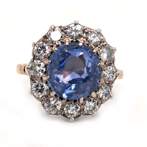 Antique Art Deco 4.50ct Cornflower Blue Ceylon Sapphire and 1.20ct Diamond Cluster Engagement Ring in 18ct white and yellow gold. Circa 1920