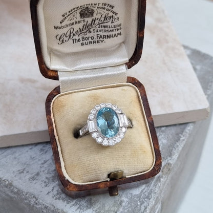 Oval Cut 2.10ct Aquamarine and Diamond Cluster Engagement Ring
