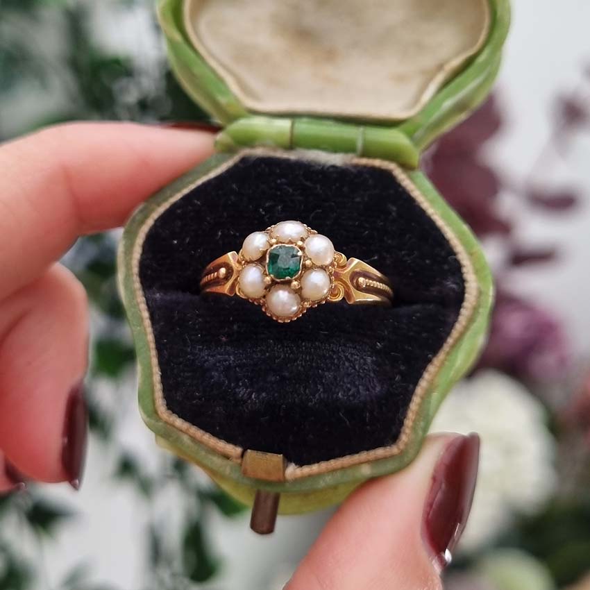 Georgian Antique Emerald and Pearl Cluster Ring, emerald surrounded by pearls in timeless floral cluster design in yellow gold accented with scrolled shoulders and gold granule detailing