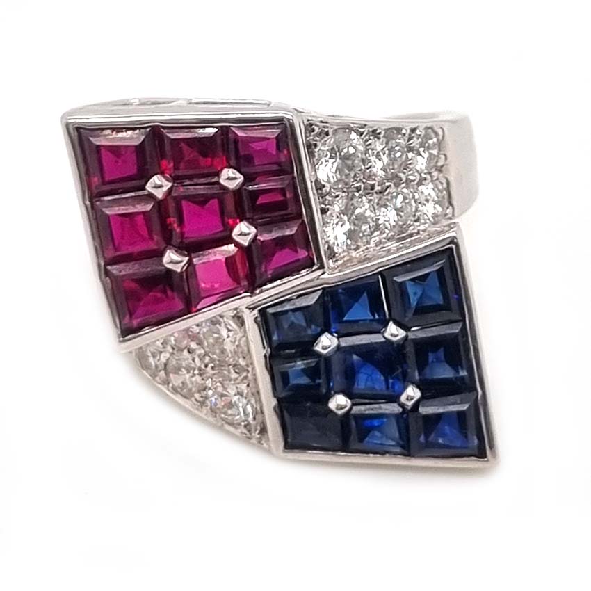 Oscar Heyman Ruby Sapphire Diamond Cocktail Statement Ring, Square cut sapphires and rubies are invisibly set into heads which lead to diamond-set crossover shoulders in 18ct white gold