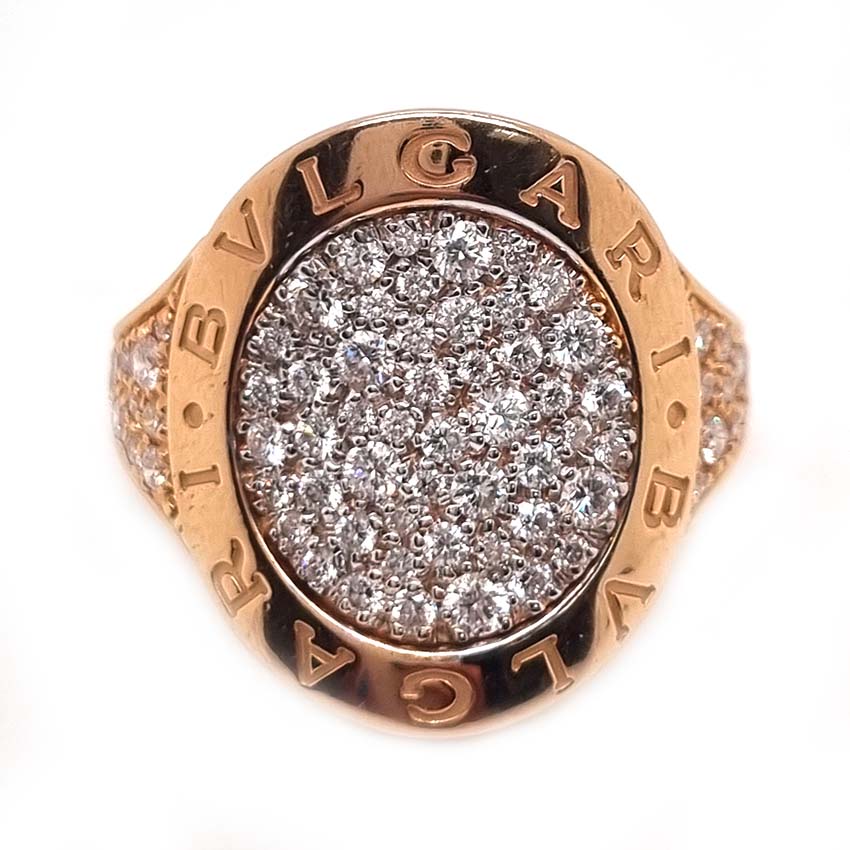 Bvlgari Pave Diamond Oval Panel Statement Ring in 18ct Rose Gold, central curved oval panel section pave-set with sparkling diamonds encased within gold border engraved with the iconic BVLGARI BVLGARI