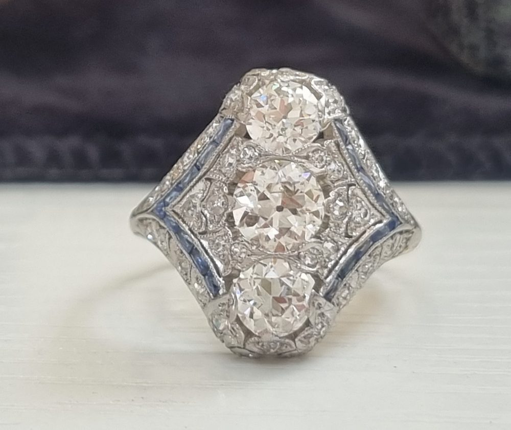 Edwardian Art Deco diamond dinner ring north to south panel dress ring platinum 1910 to 1920 blue sapphires to the side antique old cut diamonds