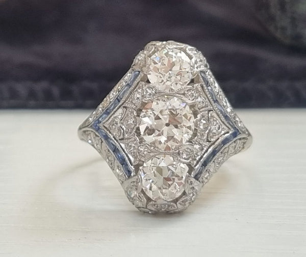 Edwardian Art Deco diamond dinner ring north to south panel dress ring platinum 1910 to 1920 blue sapphires to the side antique old cut diamonds
