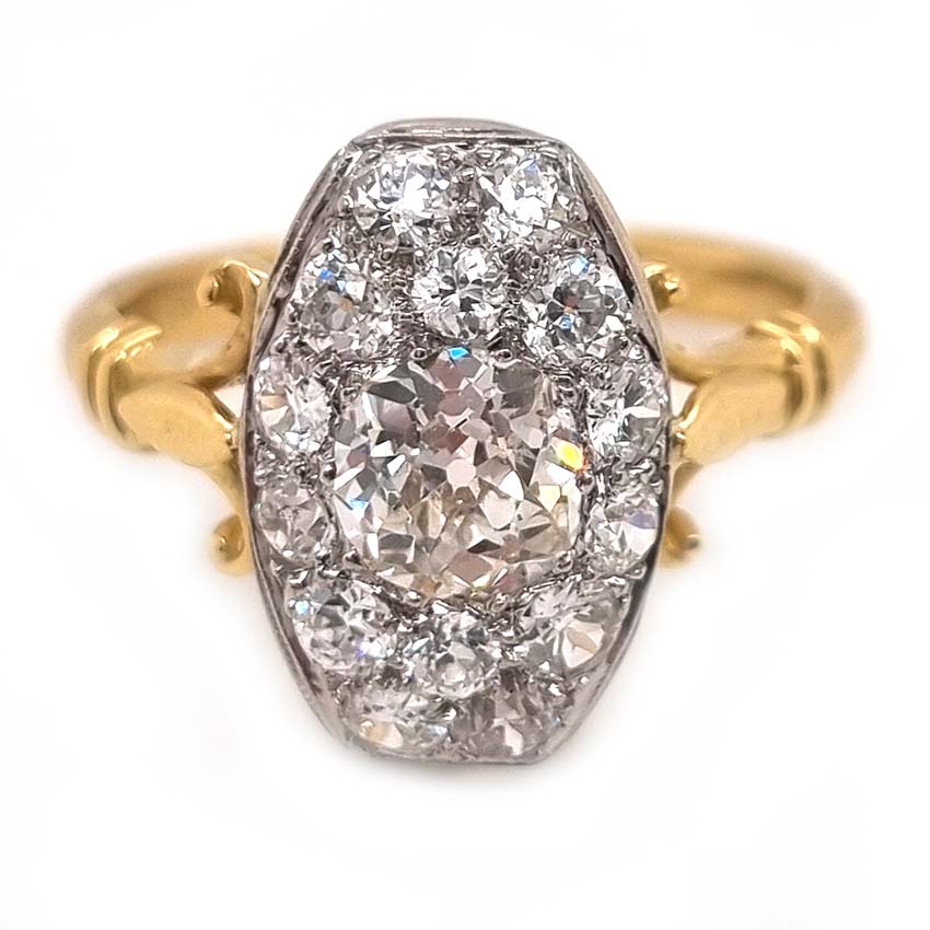 Antique Cushion Old Cut Diamond Cluster Plaque Tablet Ring, 1.08ct cushion-shaped old-cut diamond surrounded by 1.23cts old mine-cut diamonds in platinum to 18ct yellow gold, 2.31 carat total
