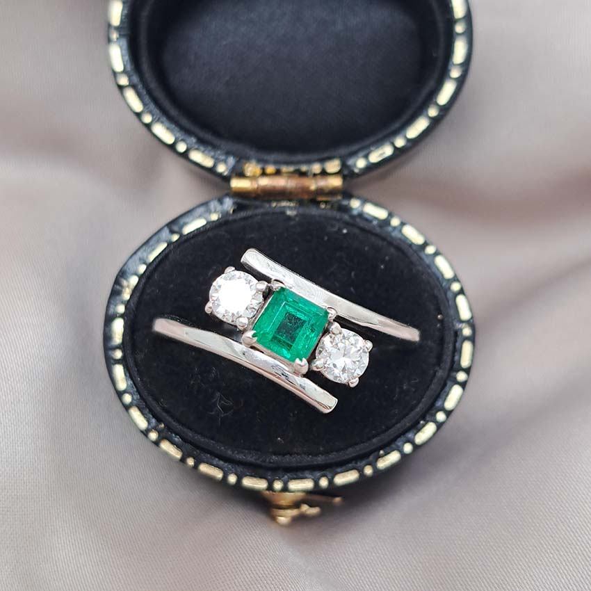 Emerald and Diamond Crossover Three Stone Ring