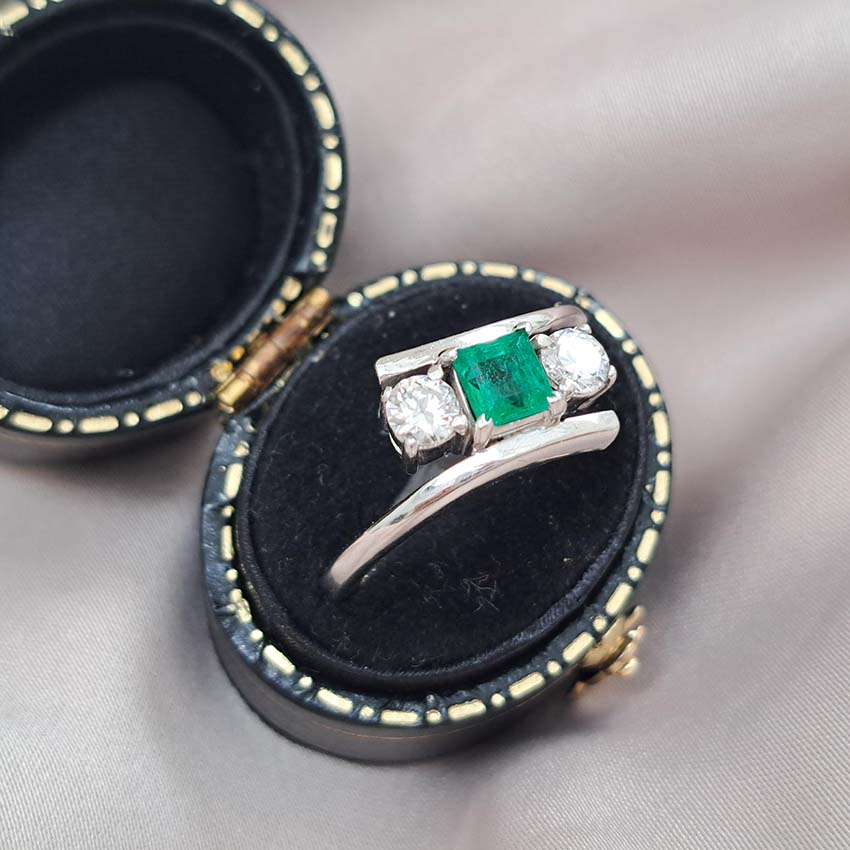 Emerald and Diamond Crossover Three Stone Ring