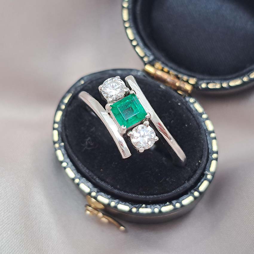Emerald and Diamond Crossover Three Stone Ring