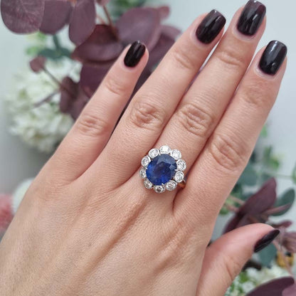 4.62ct Oval Sapphire and Diamond Flower Cluster Engagement Ring