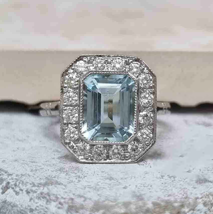 1.75ct Emerald Cut Aquamarine and Diamond Cluster Ring