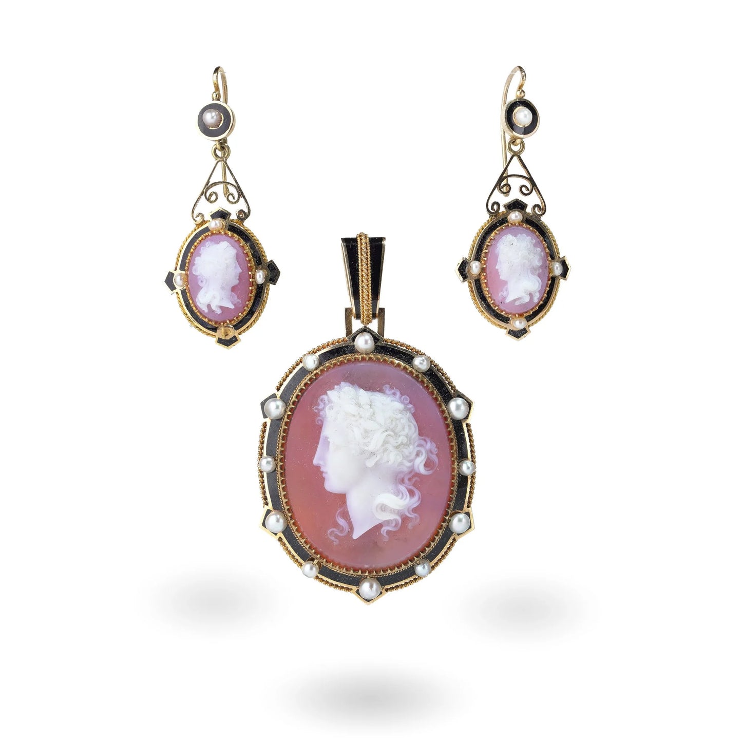 A cameo pendant and earrings suite in yellow gold with pearls and black enamel details