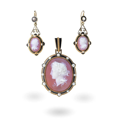A cameo pendant and earrings suite in yellow gold with pearls and black enamel details