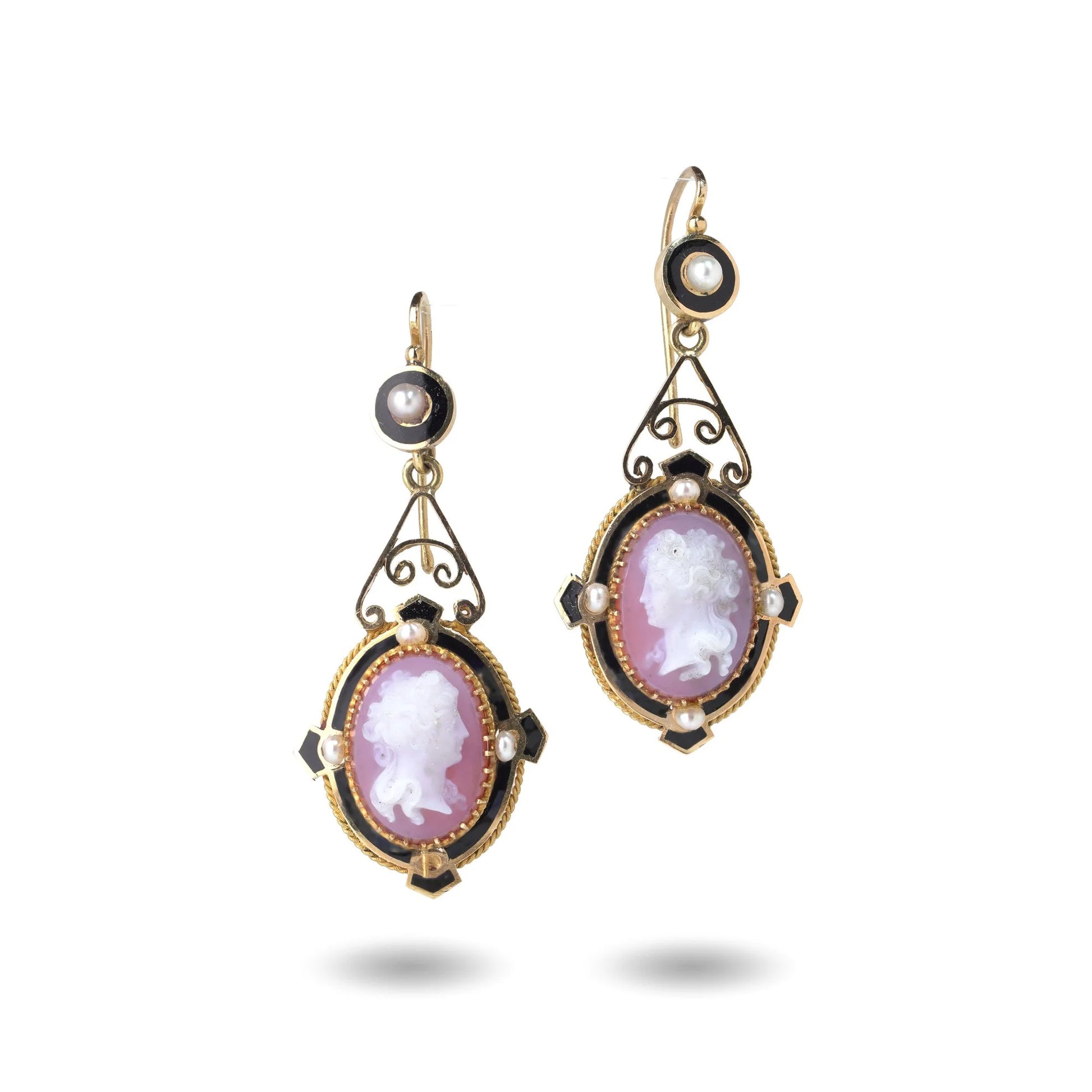 A pair of cameo earrings in yellow gold with pearls and black enamel details