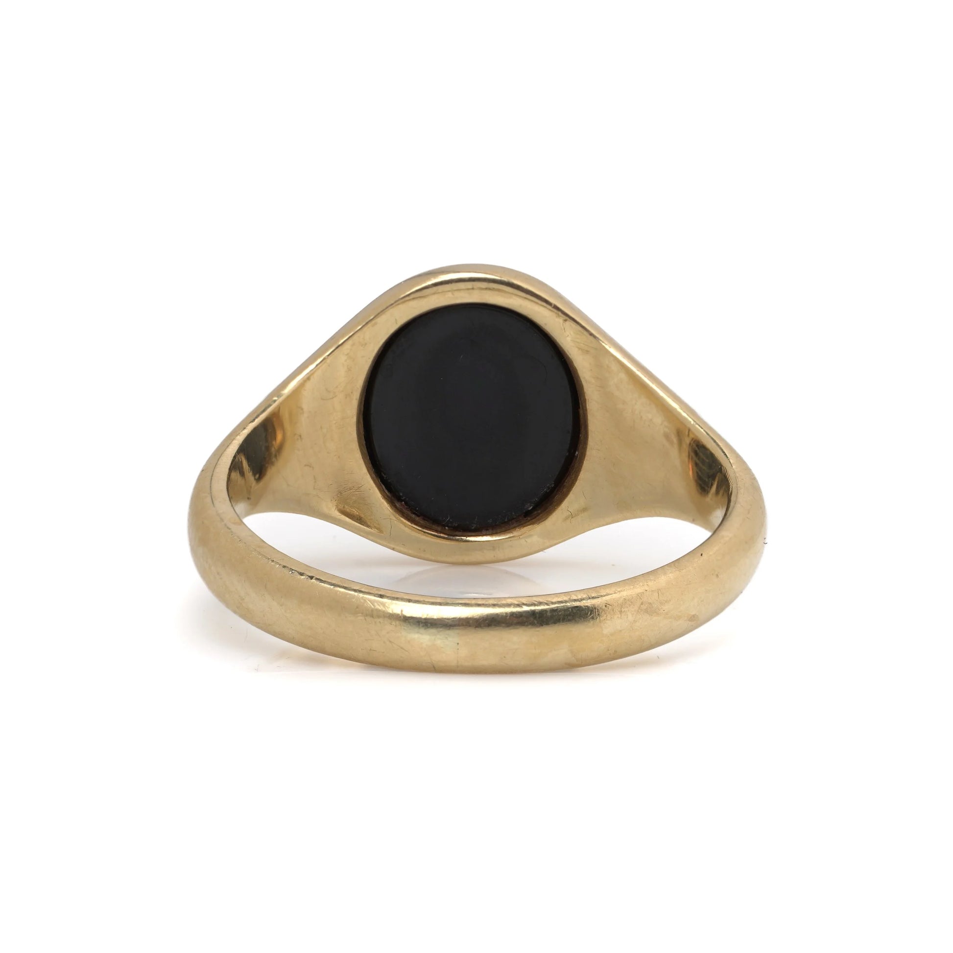 A yellow gold signet ring with an oval onyx masonic plaque