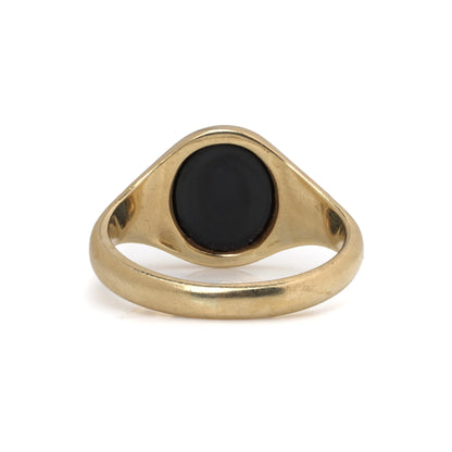 A yellow gold signet ring with an oval onyx masonic plaque