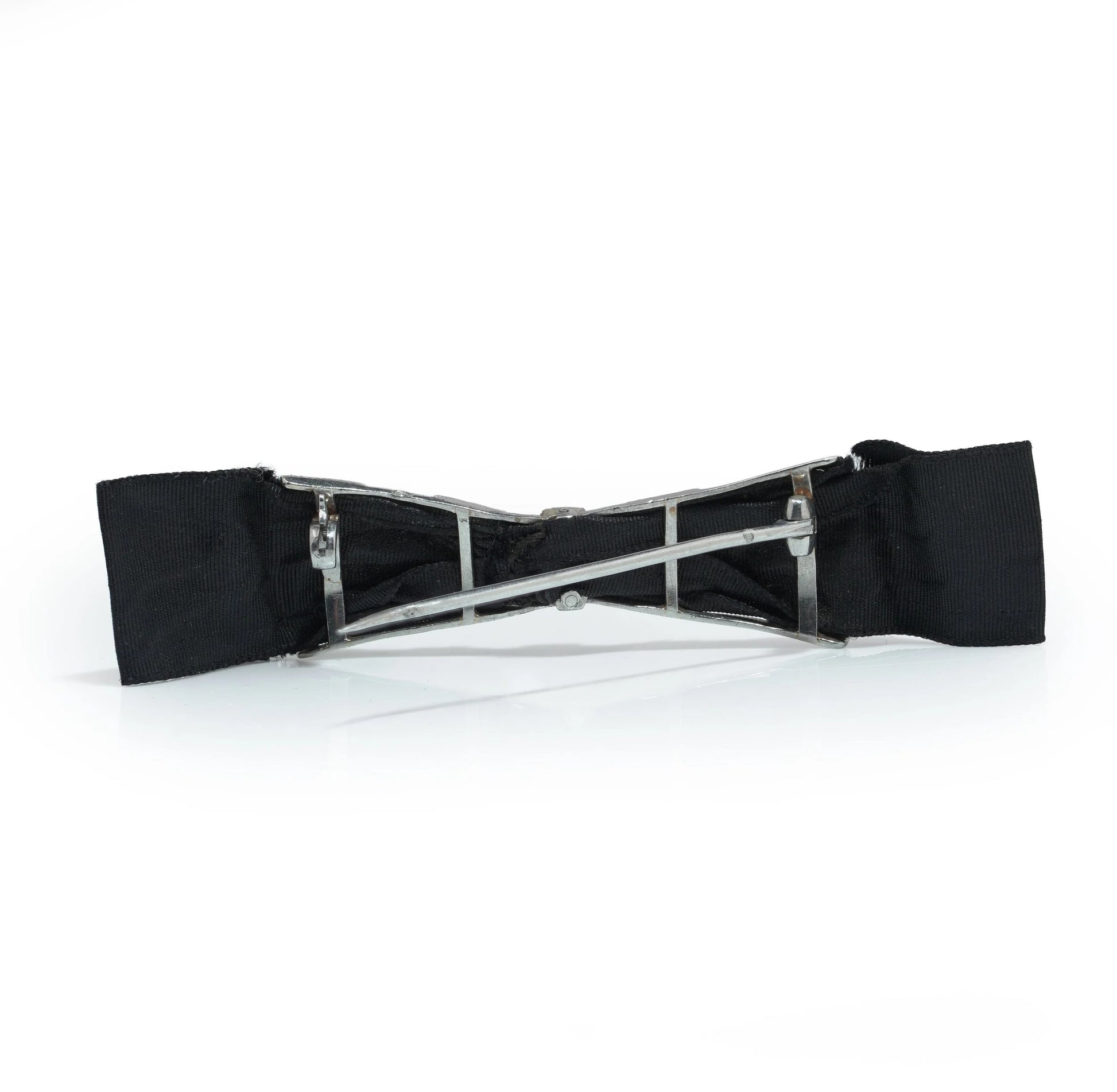 A floral design diamond and platinum bow brooch with a black ribbon