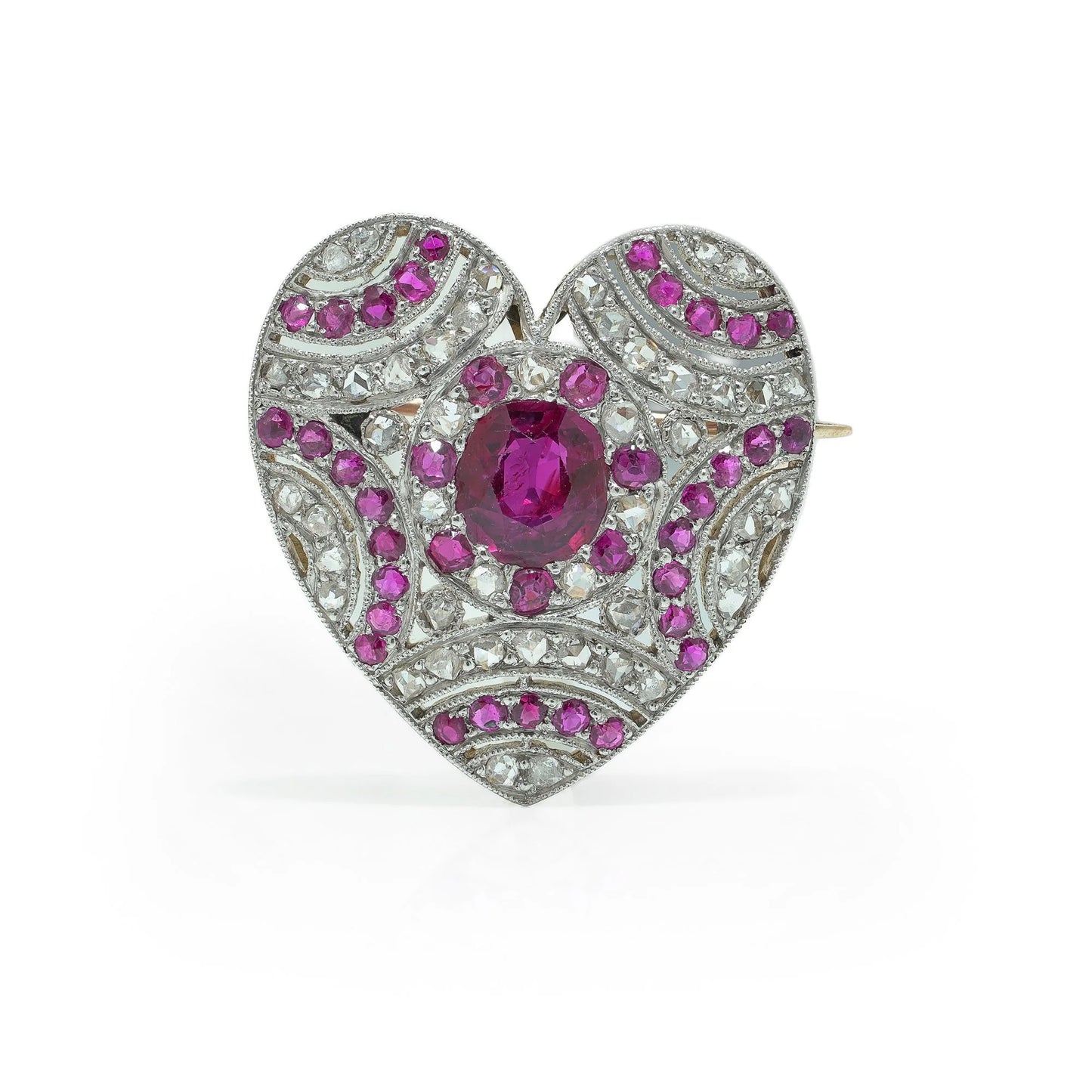 A heart shaped brooch set with rubies and diamonds, in platinum and gold
