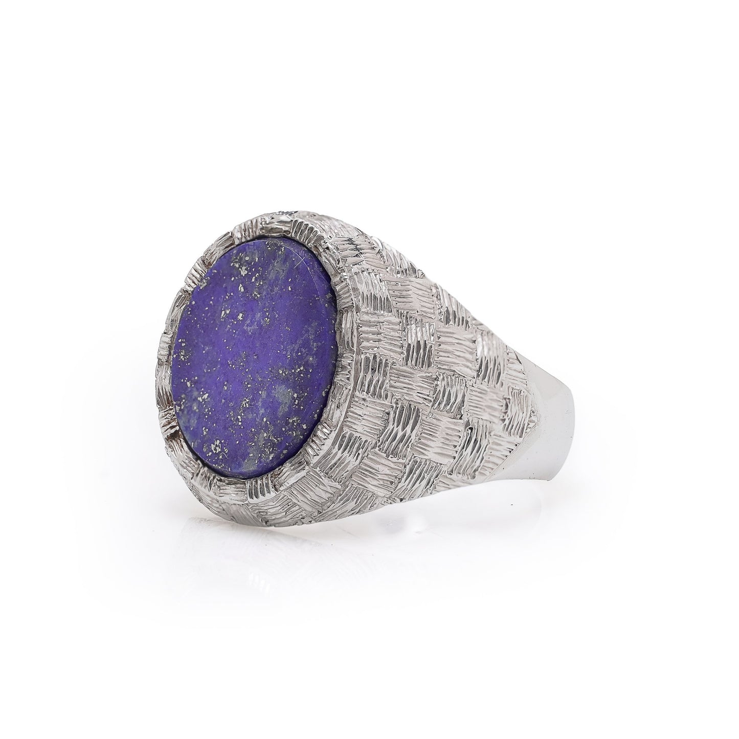 A white gold textured ring with an oval lapis lazuli