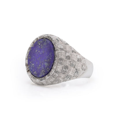 A white gold textured ring with an oval lapis lazuli