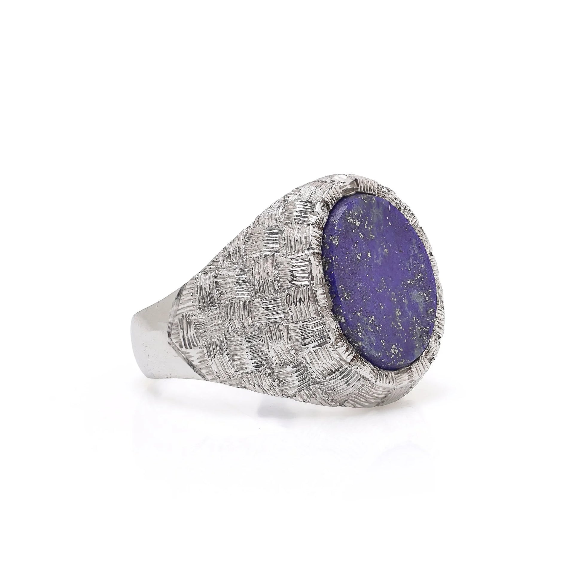 A white gold textured ring with an oval lapis lazuli