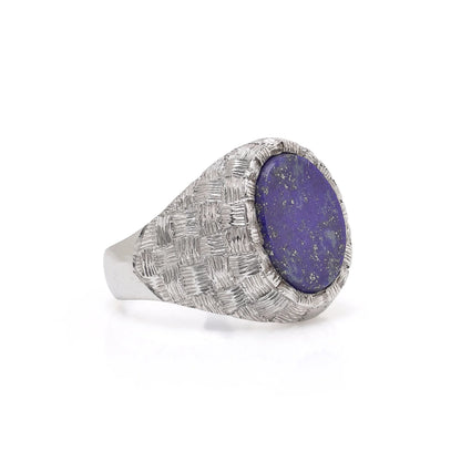 A white gold textured ring with an oval lapis lazuli