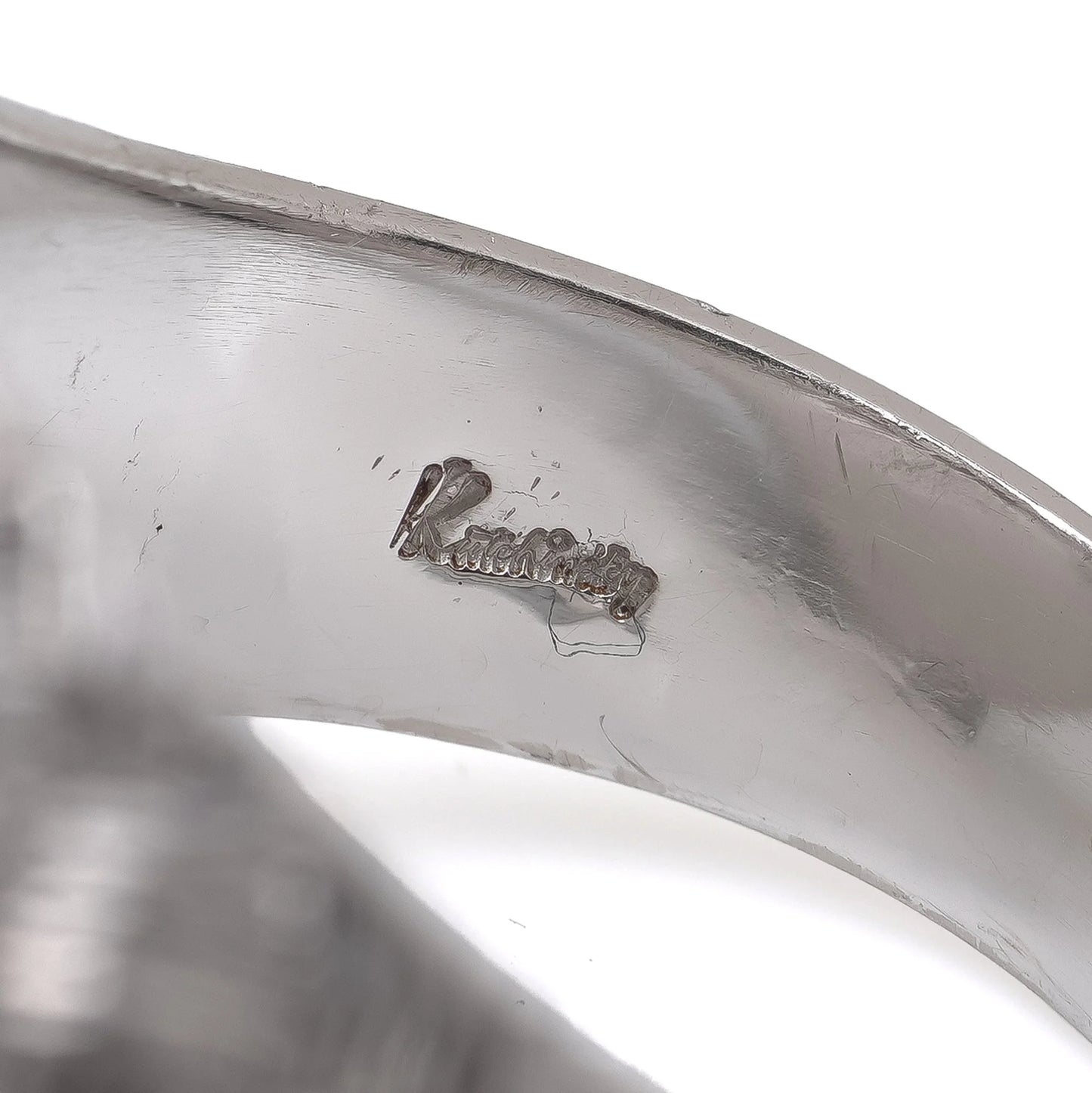 Close-up of a Kutchinsky stamp inside a ring shank