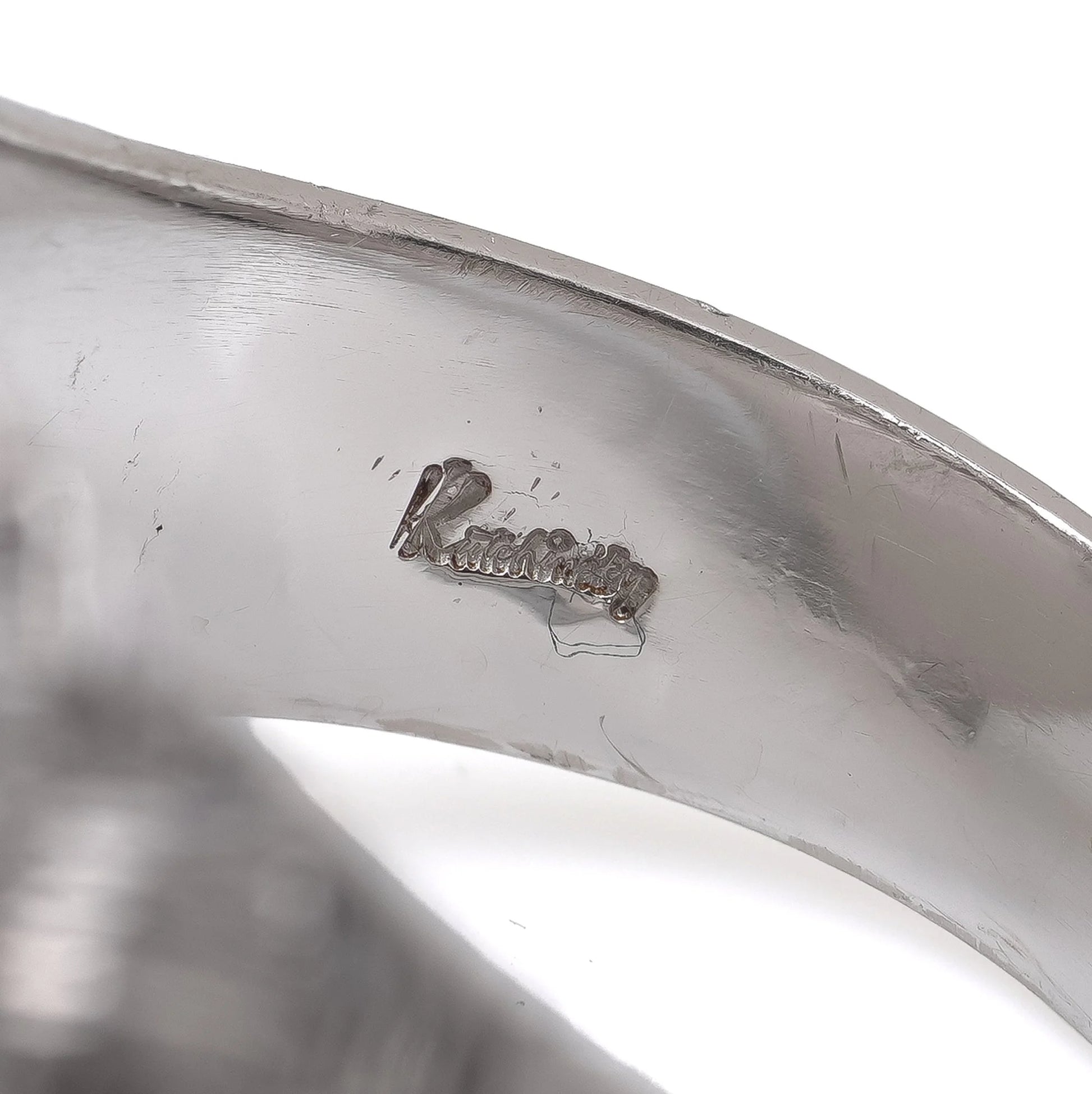 Close-up of a Kutchinsky stamp inside a ring shank