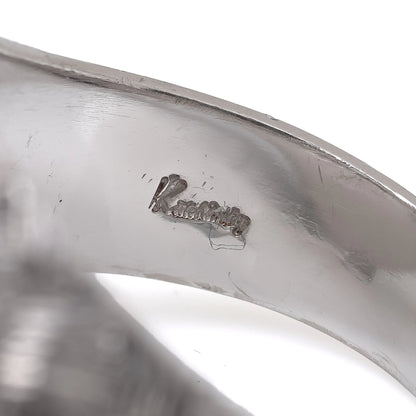 Close-up of a Kutchinsky stamp inside a ring shank